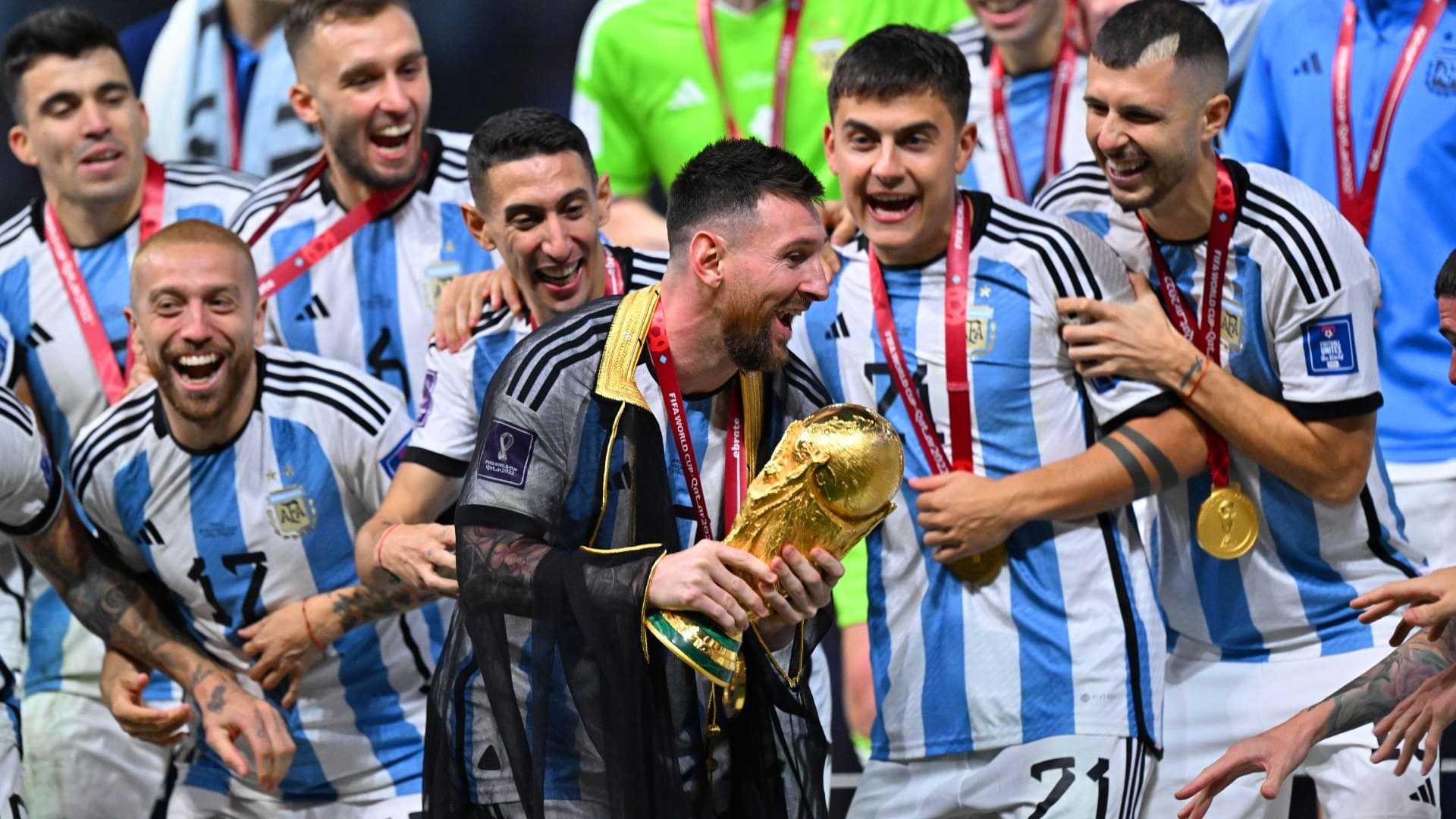 Messi Holding World Cup Wallpaper iXpap